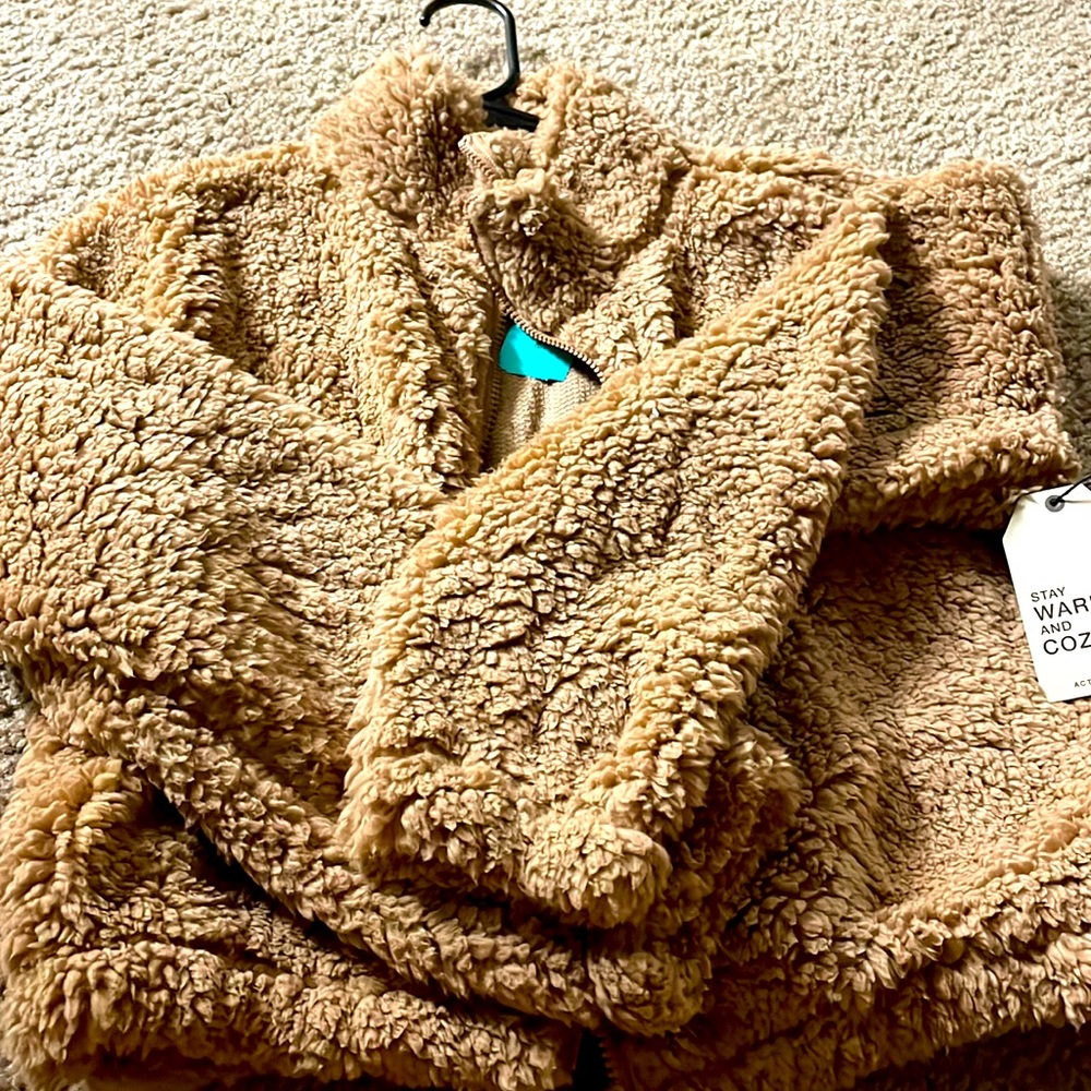 A brown fuzzy jacket